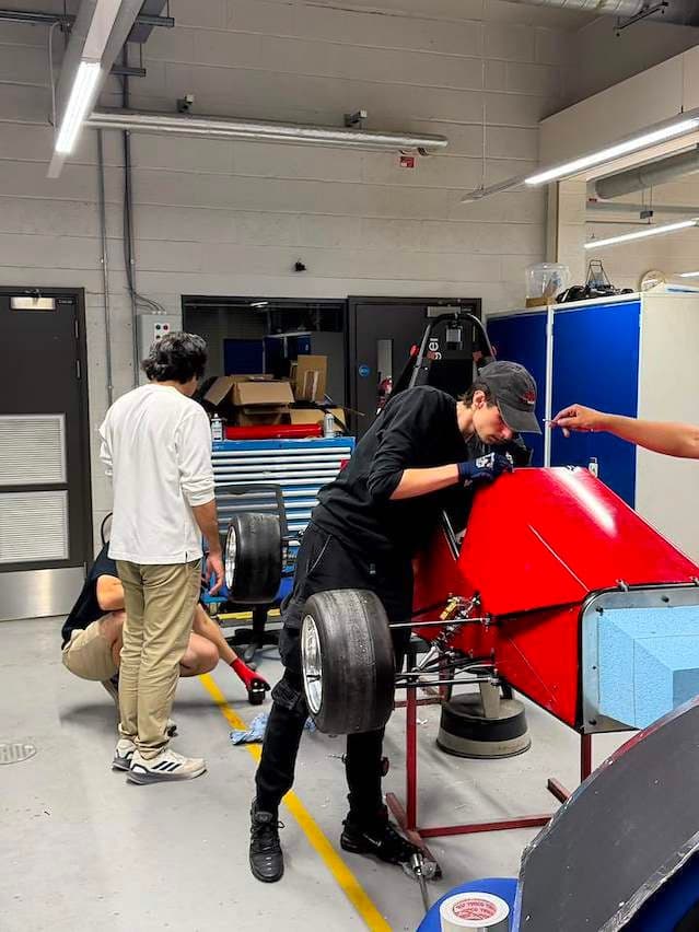 Team working on the car in the workshop